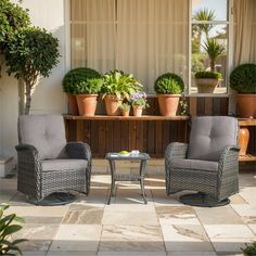 two chairs and a table on a patio