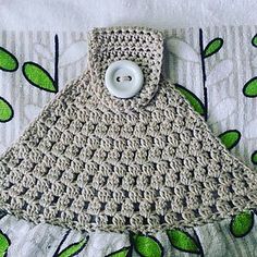 a crocheted purse with a button on it