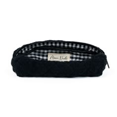 Our Space Pencil Case is a cute and stylish pouch designed to hold your stationery or brushes with a classic look.   The quilted black towel exterior is soft and luxurious, complemented by the elegant black & white gingham interior.  Ideal for storing your makeup brushes & eyeliners, or your pens & pencils (perfect for students), this bag is a must-have for those who appreciate both organization and style.  Size: 9" x 2" x 3" Gingham Interior, Storing Makeup Brushes, Black Pencil Case, Makeup Brush Case, Mini Makeup Bag, Large Makeup Bag, Black Towels, Tool Bags, Vanity Bag