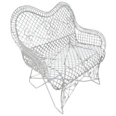 a white chair that is shaped like a heart