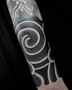 a man with a tattoo on his arm