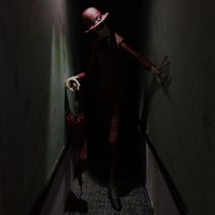 a creepy looking person with a red hat and cane walking down an alley way in the dark