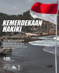 a red and white flag flying on top of a beach