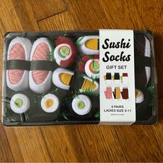 sushi snacks in a box on a wooden table