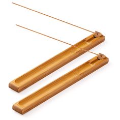 two wooden clothes pins on a white background