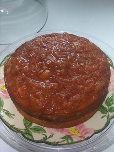 a cake sitting on top of a floral plate