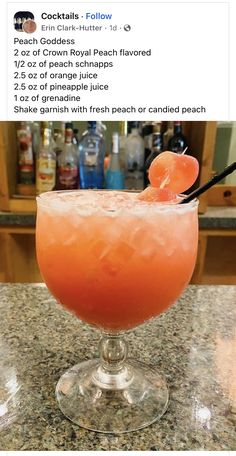 an orange drink sitting on top of a counter