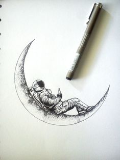 a drawing of a man sitting on the moon with a pen in his hand, next to it