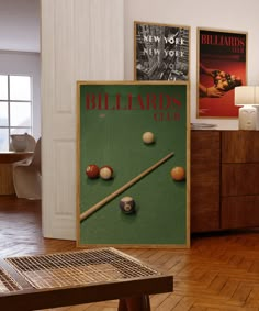 a billiards game is displayed in the living room with posters on the wall