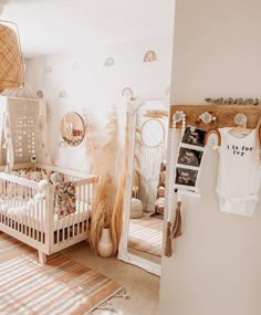 a baby's room is decorated in white and brown colors with lots of natural decor