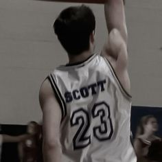 a basketball player is getting ready to dunk the ball