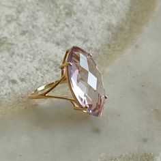 ITEM DESCRIPTION: >>The Ring is made from Solid 14K Yellow Gold. Gemstone used is absolutely natural and ethically sourced. >>Natural Pink Amethyst in marquise shape and briolette cut is studded on it with utmost precision. Gem: Pink Amethyst Gem size: 20x10 mm and Marquise Gem weight: 5.50 carat Gold purity: 14K (58.33% approx.) Gold weight: 1.30 grams Gross weight : 2.40 grams The Gold purity is guaranteed and it comes with authentic 14K gold hallmark. Since these Rings are handmade, they are Fine Jewelry 14k Gold Marquise Amethyst Ring, Marquise Amethyst Ring In 14k Gold, 14k Gold Marquise Amethyst Ring Fine Jewelry, 14k Gold Lavender Amethyst Ring, 14k Gold Diamond Cut Amethyst Ring, 14k Gold Amethyst Ring With Diamond Cut, Fine Jewelry, 14k Gold Amethyst Ring With Diamond Cut, Gift Marquise Amethyst Ring In Yellow Gold, Gold Marquise Amethyst Ring In 14k