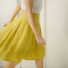 "Yellow Linen Skirt, Linen Retro Skirt, Linen Pleated Skirt Every item is handmade to order and to your personal body measurements (made to measure). DESCRIPTION: -High Waist -Pleats from the waist down -Pockets -Mid Length -Handcrafted Color in the picture- spring yellow and green grey. Other colors are available. ETHICALLY MADE. Every linen garment is handmade using the body measurements of the individual customer. No factory use. Every creative and sewing task is fairly rewarded. Material: 10 Pleated Green Full Skirt, Casual Green Pleated Full Skirt, Elegant Yellow Pleated Skirt For Summer, Elegant Yellow Pleated Summer Skirt, Knee-length Pleated Relaxed Skirt, Green Pleated Knee-length Bottoms, Elegant Yellow Pleated Skirt, Summer Full Skirt Bottoms With Pleated Waist, Fitted Yellow Gathered Skirt