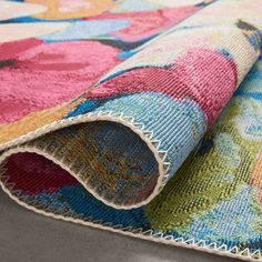 a multicolored rug with an intricate design