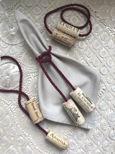 three wine corks are tied to a napkin