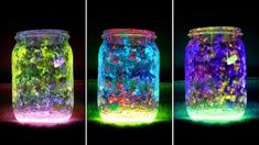 three jars with different colored lights in them