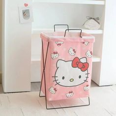 a hello kitty shopping bag sitting on the floor