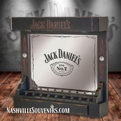 an old fashioned jack daniels machine with the words jack daniels on it's side