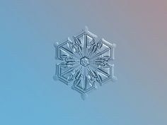 the snowflake looks like it is floating in the air