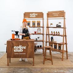 a woman standing behind a coffee shop counter