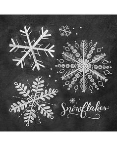 three snowflakes are drawn on a blackboard