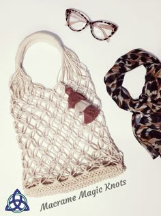 two scarves, a scarf and glasses on a white surface