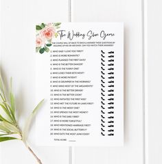 a printable wedding game for the bride and groom with flowers on it, sitting next to a plant