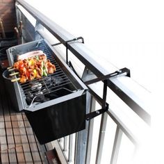 an outdoor grill with food cooking on it