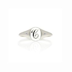 This initial and diamonds mini signet ring makes the perfect pinky ring–  personalized with an initial of your choosing is hand engraved in a classic script font by our master engraver here in Hatton Garden, and set with 2 diamonds either side to give it extra sparkle – under-stated elegance with a vintage, personalised feel – this ring would make a fabulous gift for a special occasion.Effortlessly stylish our monogram ring looks great worn as a pinky ring or on other fingers for a minimalist lo Silver Initial Ring With Diamond Accents For Wedding, Silver Wedding Initial Ring With Diamond Accents, Wedding Initial Ring In White Sterling Silver, Elegant White Initial Ring Engraved, Elegant White Initial Ring With Engraving, Elegant White Engraved Initial Ring, White Engraved Diamond Ring, Personalized Silver Cubic Zirconia Diamond Ring, Classic Silver Initial Ring With Diamond Accents