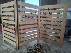 a room divider made out of plywood and some screwdrives on the floor