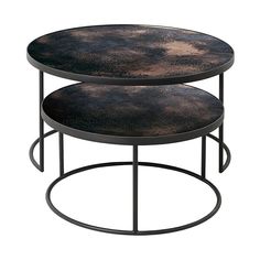 two round tables with black metal bases and brown marbled tops, one on each side