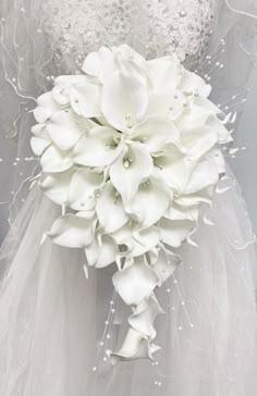 a bridal bouquet with white flowers on it