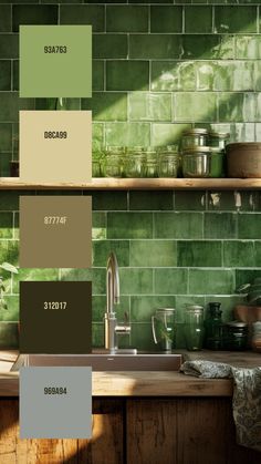 a kitchen with green tiles and wooden shelves in the center, along with various colors of paint swatches