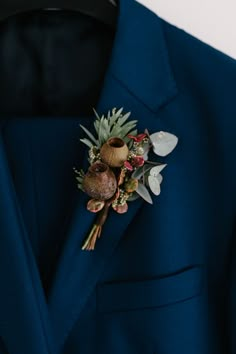 close up photo of an Australian native flower buttonhole Australian Native Flowers Wedding Bridal Bouquets, Wedding Bouquets Australian Natives, Wedding Bouquets Australian, Wedding Bouquet Australian Native, Native Bridal Bouquet Australian, Australia Native Bouquet, Australian Native Flowers Wedding Buttonhole, Australian Native Boutonniere, Banksia Wedding Bouquet