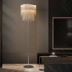 a modern floor lamp in the corner of a living room with marble walls and floors