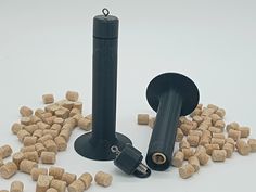 there are many small pieces of wine corks next to a bottle opener and cork stopper