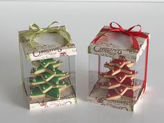 two small boxes with christmas cookies in them