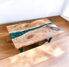 a wooden table sitting on top of a hard wood floor