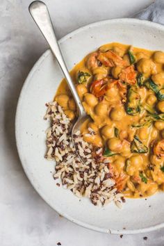 a white bowl filled with beans and rice