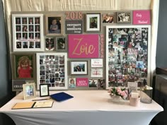 a white table topped with pictures and photos