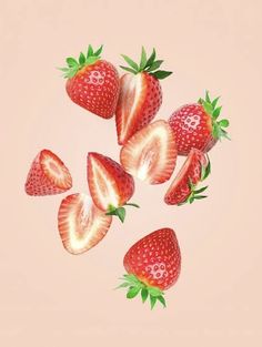 five strawberries flying in the air on a pink background