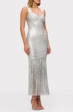 Turn heads in this stunning metallic bandage dress fashioned in a body-con silhouette and finished with dramatic fringe that flutters with every step. 53" length Hidden back-zip closure V-neck Sleeveless 90% recycled rayon, 9% nylon, 1% spandex Dry clean Imported Fringe Gown, Daytime Dresses, Womens Knit Dresses, Recycled Yarn, Herve Leger, Reduce Waste, Silver Foil, Bandage Dress, Sweetheart Neckline