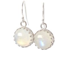 "Stunning Rainbow Moonstone Dangle Earrings made with genuine moonstone (June Birthstone) and set in sterling silver crown bezel setting. These earrings could make a wonderful gift for someone born in June! Just one pair available, and READY TO SHIP. MATERIALS: * natural rainbow moonstone * dangling from French hooks or leverbacks * Sterling Silver * come in our beautiful gift box + card about moonstone SIZE: * moonstones: 10x10 mm * earrings from top to bottom: - 1,8 cm or 3/4\" with french hoo Silver Moonstone Birthstone Earrings, Dainty Nickel-free Moonstone Earrings, Silver Moonstone Earrings With Birthstone, White Moonstone Birthstone Earrings, Silver Birthstone Earrings With Moonstone, Dainty Moonstone Earrings Nickel Free, Round Moonstone Cabochon Earrings, Delicate White Moonstone Earrings, Nickel-free Moonstone Round Earrings