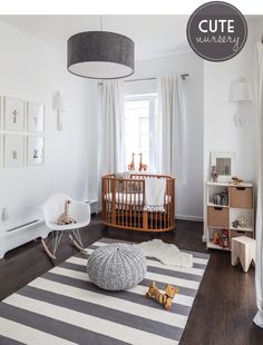 a baby's room is decorated in white and gray