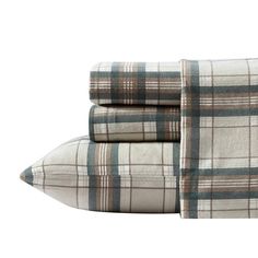 the plaid sheets are folded on top of each other