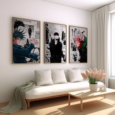 a living room with three paintings on the wall and a white couch in front of it