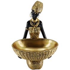 an african woman is sitting in a bowl with gold accents on the bottom and sides