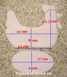 the measurements of a chicken cut out from paper