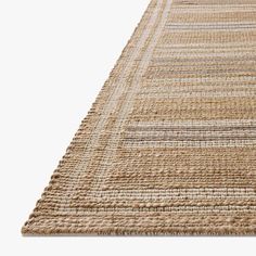 a beige rug with stripes on it