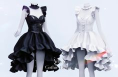 two female mannequins dressed in black and white dresses with ruffles